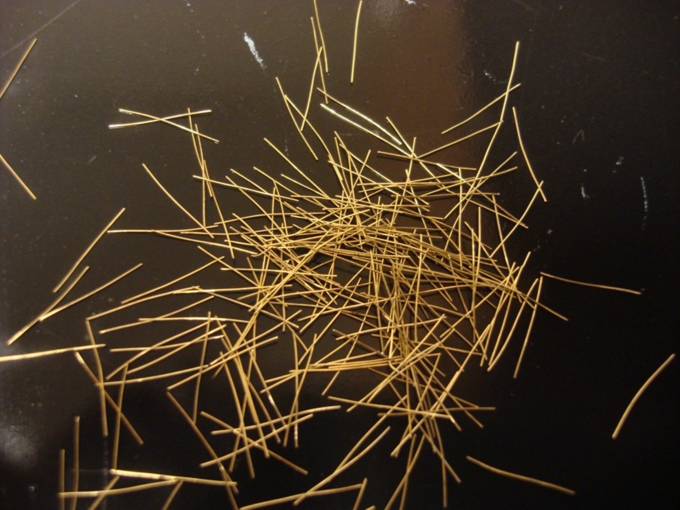 High-strength steel fibers like this are mixed into concrete to make it even stronger and tougher. Shih-Ho Chao, CC BY-ND 