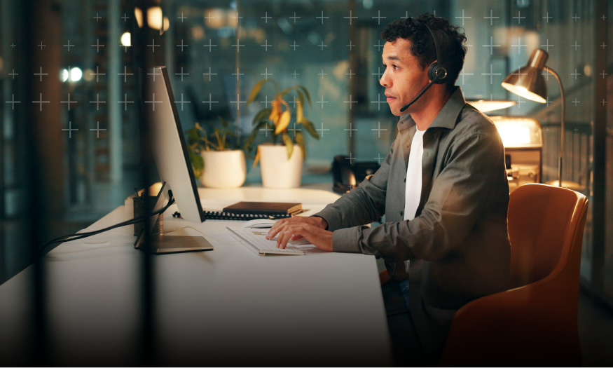 Man with headset using computer