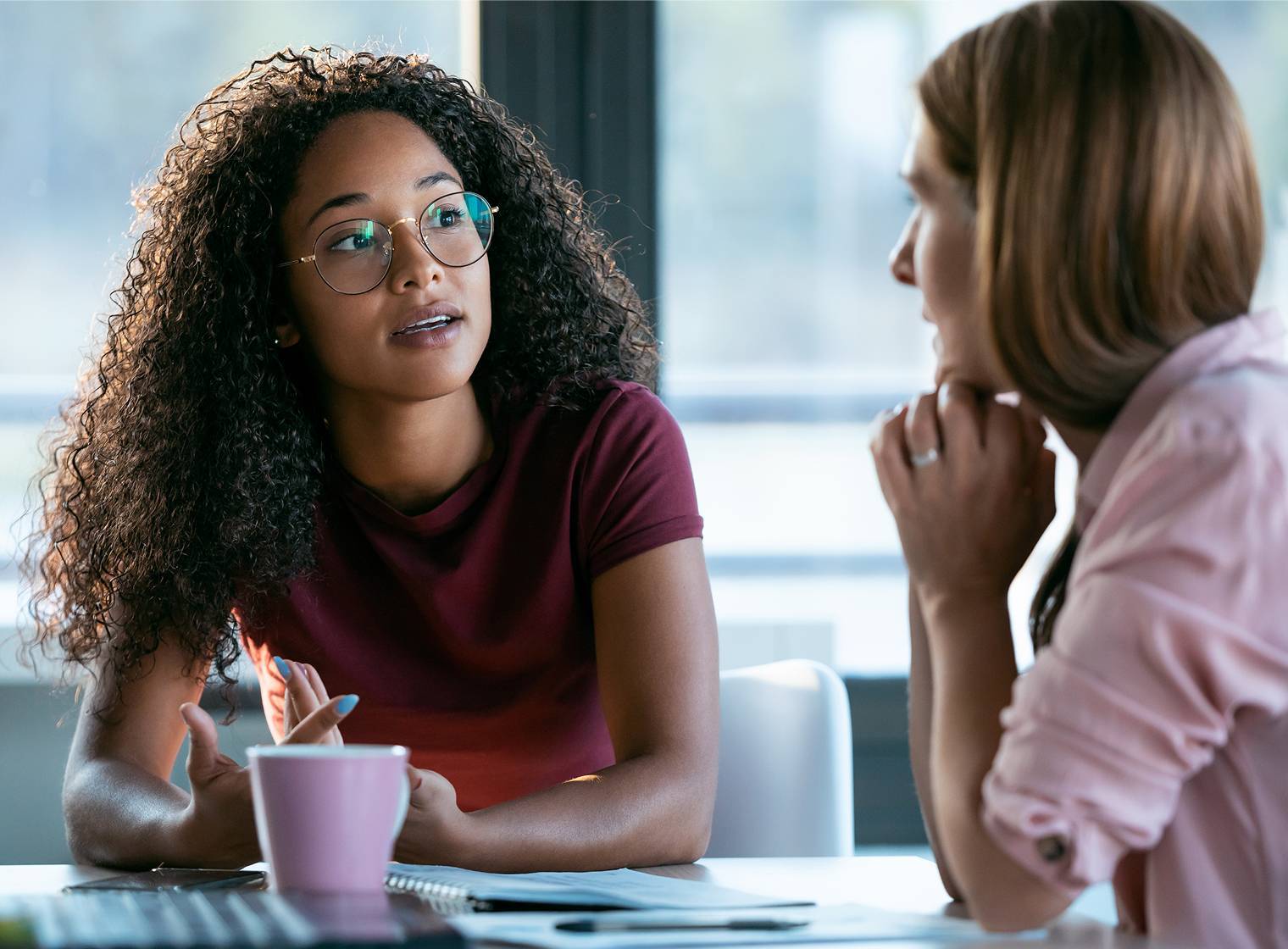 women chatting in an office